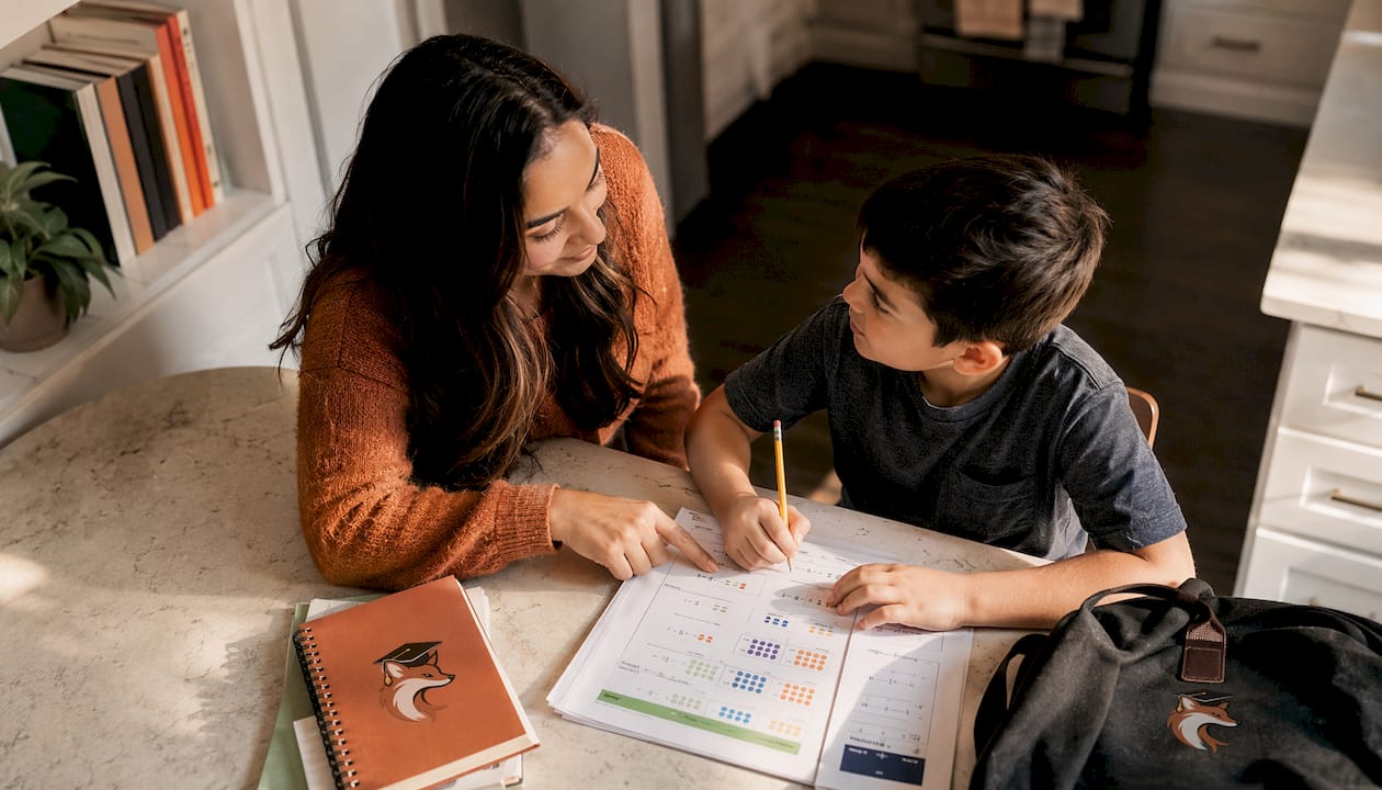 Mother helping son with homework