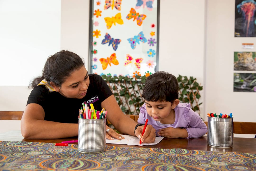 Mother and toddler playing educational blocks