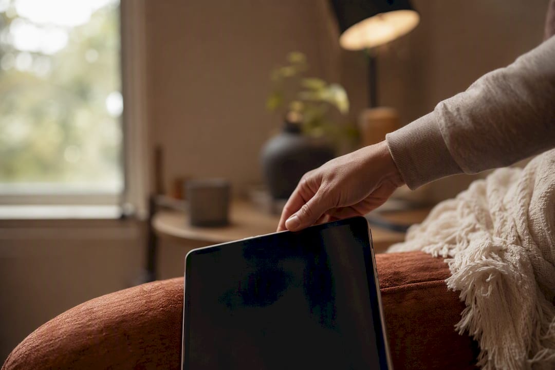 Parent holding tablet evaluating tutor fit