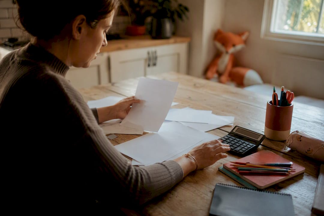 Hands sorting budget for tutoring fees